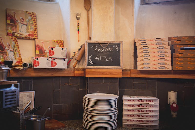 Dewey's Pizza team working together in a lively restaurant